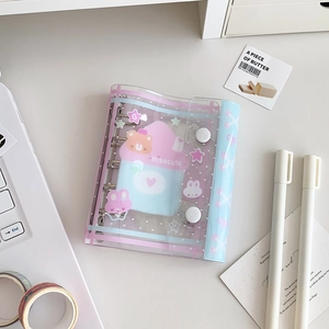 Detail of transparent PVC notebook shell with pink snap button and 6-hole binder rings