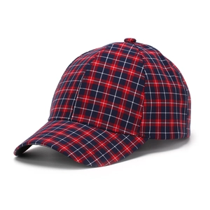 Macro side view of classic red and blue plaid baseball cap showing fabric texture