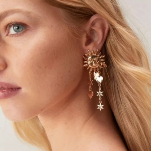 Golden stainless steel long tassel earrings featuring sun face star and heart pendants