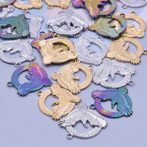 Detail of round hollow eagle charms in gold, silver, and rainbow stainless steel finishes