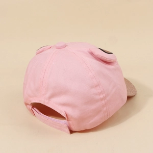 Pink kids baseball cap with cute ears and sparkling gold sequin brim seen from back
