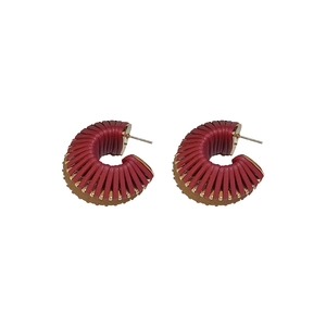 Modern C-shaped faux leather threaded earrings in vibrant red and tan color contrast