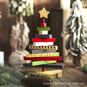 Handcrafted rotating wooden Christmas tree building block ornament with a star topper