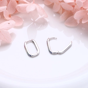 Detail of S925 sterling silver U-shaped hoop earrings with colorful rainbow cubic zirconia