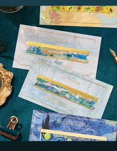 Macro detail of brass hollowed-out metal bookmark ruler featuring world famous oil paintings