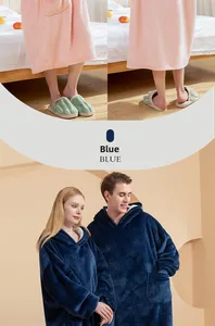 Detail of thick flannel hoodie blanket with oversized pockets and soft warm texture