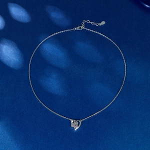 S925 sterling silver necklace with pink zircon cat paw heart pendant on blue background