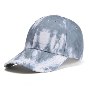Detail of gray tie-dye baseball cap featuring a six-panel crown and embroidered eyelets