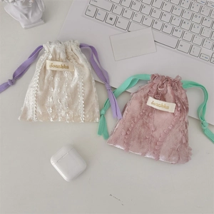 Detailed view of lace trim velvet drawstring pouches for jewelry and small accessories