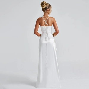 Detail of white satin evening dress featuring an open back and criss-cross tie-up design
