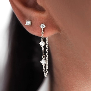 Detail of S925 silver chain tassel earrings with four-prong set cubic zirconia stones