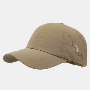 Detail showing laser-cut breathable mesh and fine triple stitching on a khaki baseball cap