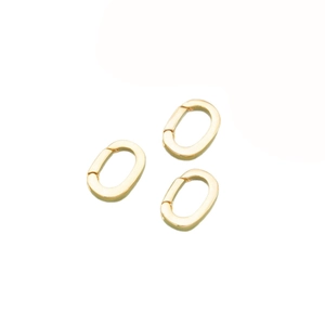 Three 18k gold plated oval spring clasps for DIY jewelry making on white background