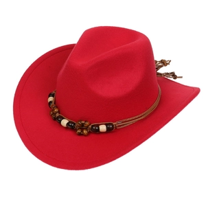 Detailed view of red felt cowboy hat with brown braided band and wooden beads decoration