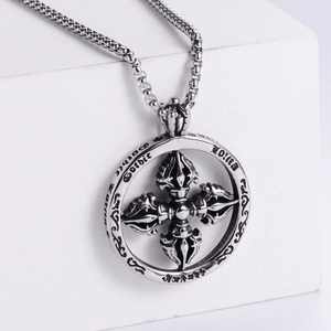Detailed view of stainless steel Gothic Lolita pendant with Vajra center on a white stand