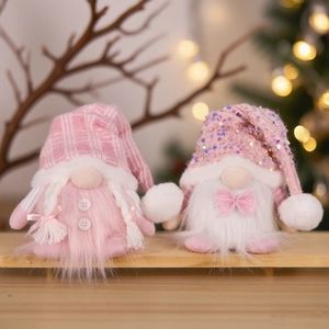 Pink and white sequined Christmas gnome plush figurines with glowing knit hats for decor