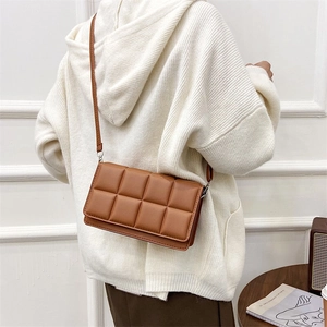 Brown quilted crossbody bag in matte synthetic leather with adjustable shoulder strap