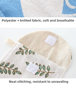 Detail of leaf embroidery on polyester fabric pouch with white hook and loop closure