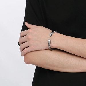 Punk wolf head stainless steel braided cuff bracelet for men on a model wrist