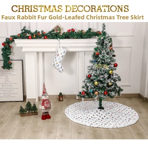 White faux fur Christmas tree skirt featuring gold foil trees in a cozy home setting