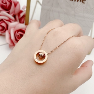 Minimalist rose gold titanium necklace with Roman numerals pendant and crystal inlay