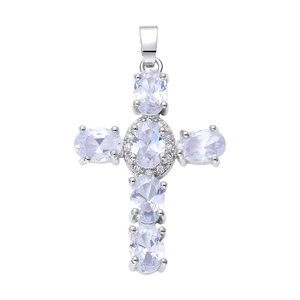 Detailed view of silver cross pendant with oval cubic zirconia stones on white background