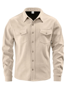 Detailed macro view of corduroy texture and chest pockets on beige long sleeve shirt