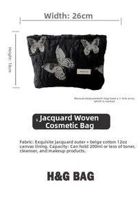 Detail of jacquard butterfly makeup bag with silver embroidery and dimensions 26x18cm