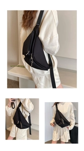 Detail of black nylon chest bag with multiple zippers and wide strap on model
