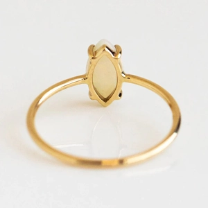 Macro view of gold-plated S925 sterling silver ring with marquise cut opal stone