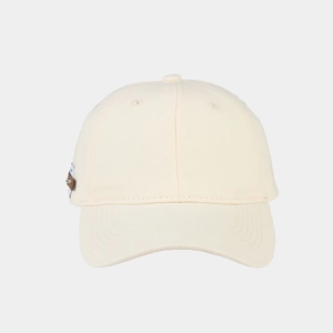 Detailed view of beige cotton baseball cap featuring a premium side leather logo patch