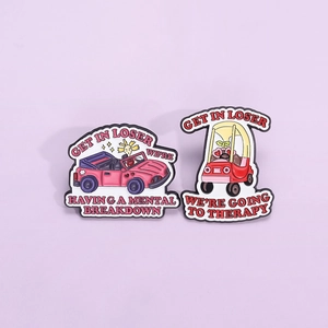 Funny enamel car pins with Get In Loser quotes on a purple background