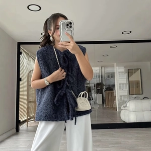 Women's casual navy blue fuzzy vest with tie-front design and sleeveless loose fit style