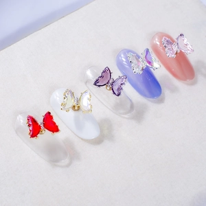 Rotating 3D crystal butterfly nail art charms in five colors on metal base