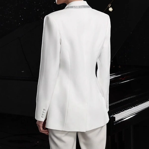Detailed back view of white slim-fit blazer with tailored waist and rhinestone lapels