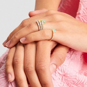 Close-up of double-layer gold snake ring with micro-pave zircon and turquoise enamel