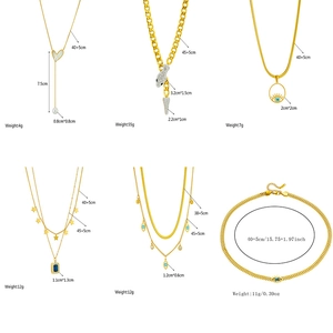 Collection of golden layered necklaces with heart, eye, and pearl pendants for women