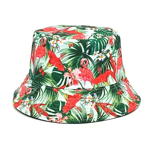 Detailed pattern of tropical flamingo and palm leaf print on a canvas bucket hat