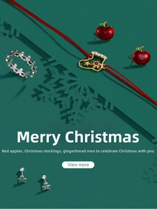 Detailed close-up of festive Christmas jewelry set featuring apple and gingerbread motifs