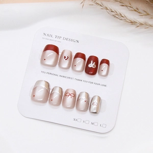 Handmade red and pearl white cat-eye press-on nails with 3D heart and bow designs