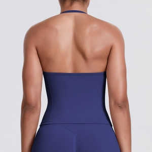 Detailed back view of dark blue halter yoga top showing seamless fabric and stitching