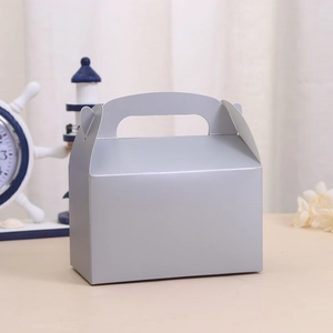 Elegant silver-grey party gift box with handle for cakes and sweets in lifestyle setting