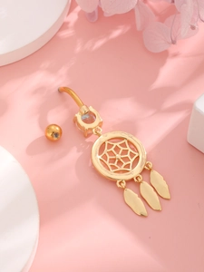Golden dreamcatcher belly button ring with feathers and crystal on pink floral display