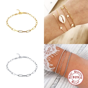 Gedetailleerde weergave van gouden en zilveren S925 sterling zilveren paperclip armbanden