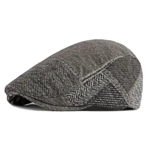 Classic dark grey herringbone tweed newsboy cap for men and women in British retro style