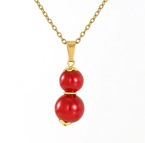 Detailed close-up of a red gourd pendant on a gold 18k stainless steel necklace chain