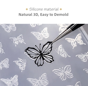 Macro shot of a 3D butterfly silicone mold showing easy de-molding with tweezers