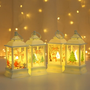 Set of four ivory Christmas lanterns with LED lights featuring festive holiday patterns