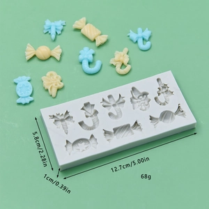 Christmas candy silicone mold for DIY baking with bow and cane shapes on green background