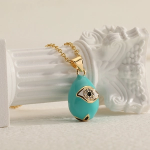Evil eye water drop pendant with blue enamel and zircons on a gold-tone chain